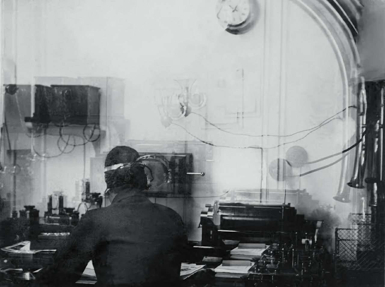 Titanic's Marconi wireless room with Harold Bride seated at the desk